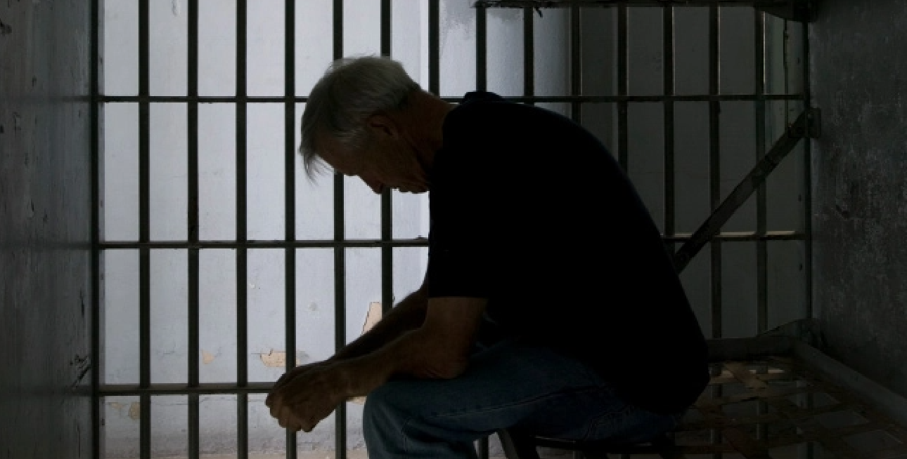 Man sitting in prison